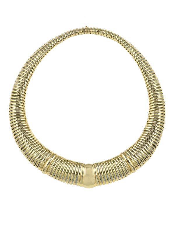 Gold tubogas necklace. Signed and numbered Cartier n. 716393