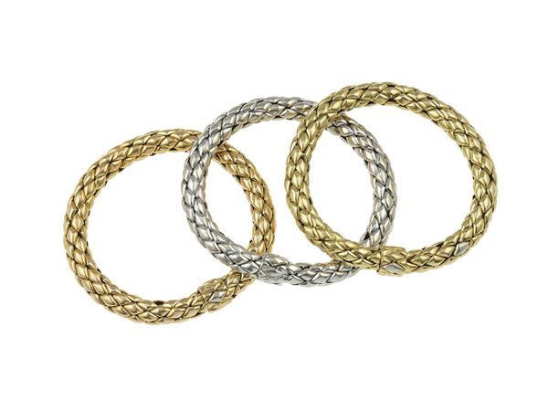 Three gold bracelets. Signed Chimento