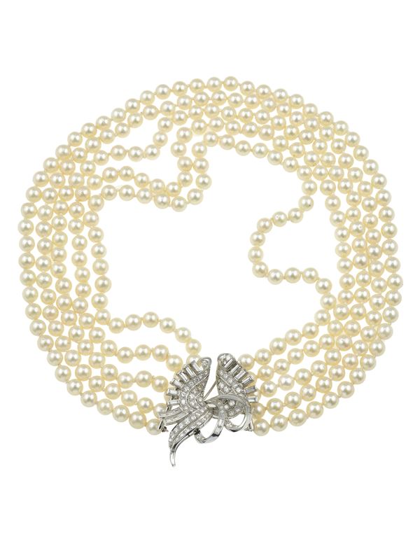 Cultured pearl and diamond necklace. The clasp is convertible into a brooch