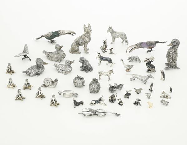 Insieme di animali e oggetti in argento. Argenteria italiana del XX secolo, argentieri differenti