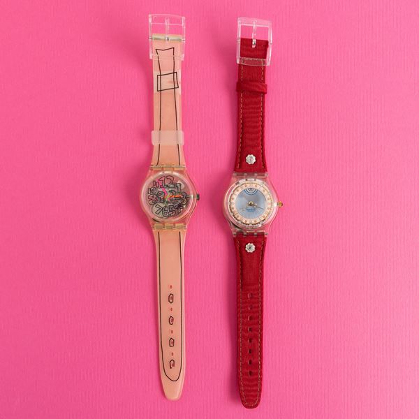 Due orologi Swatch con scatola