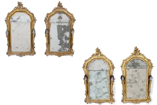 Quattro specchiere in legno intagliato e dorato. XVIII secolo
