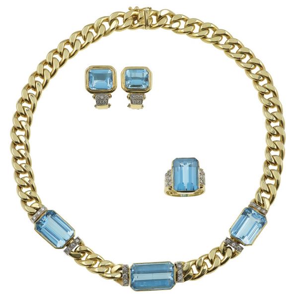 H. Stern. Parure composta da girocollo, anello ed orecchini con topazi blu e diamanti