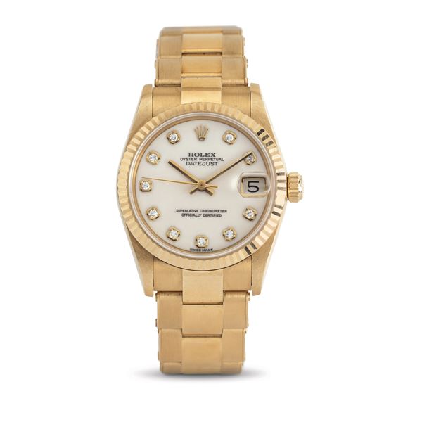 Rolex - Fine and elegant Datejust ref 68278, Opal dial with diamond markers, 18k yellow gold riveted case and bracelet accompanied by original warranty