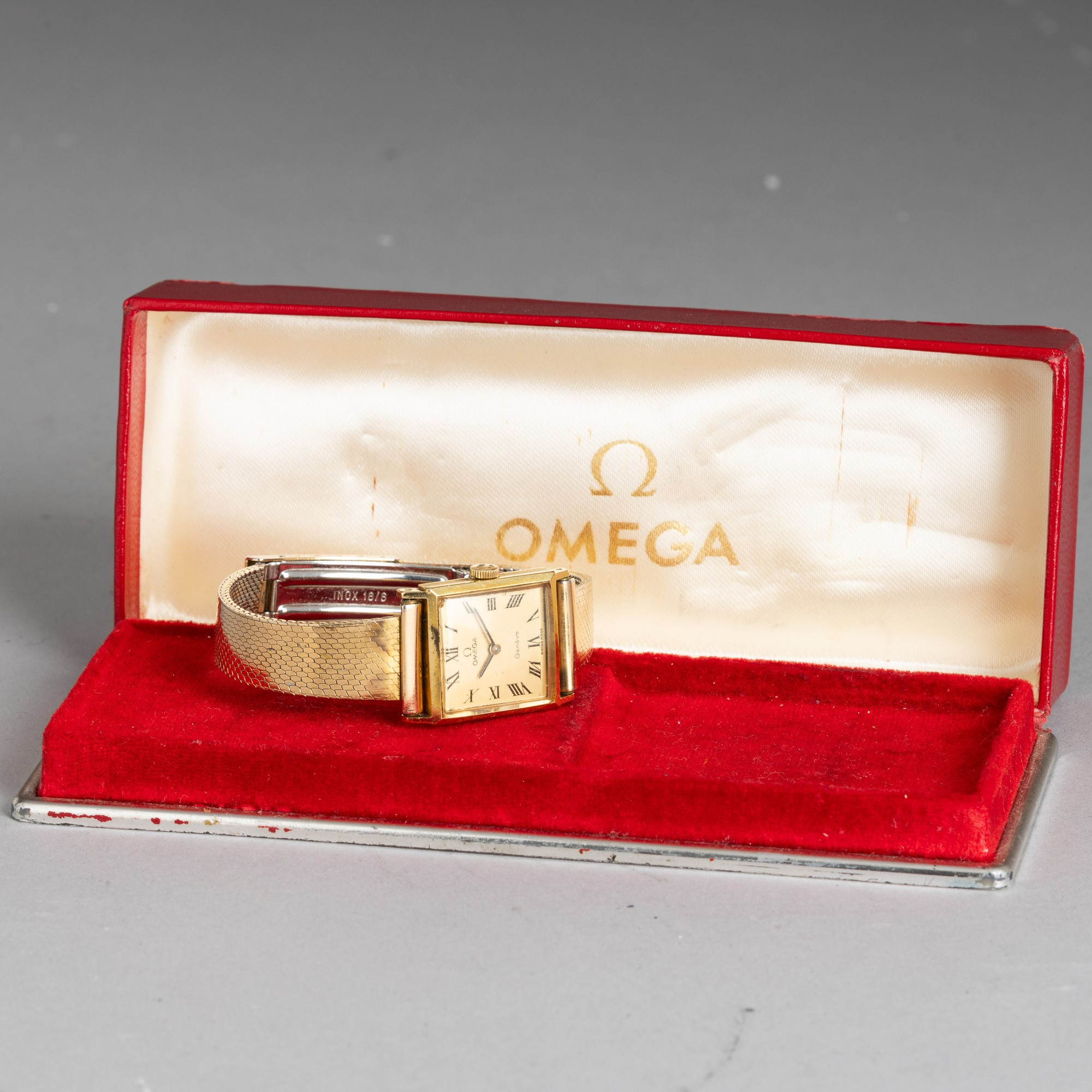 Omega - Lady Rettangolare in Oro Giallo 18k, Bracciale Laminato, Carica Manuale Quadrante Champag...