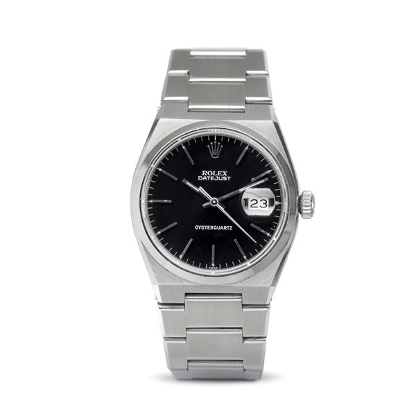 Rolex - Original and attractive steel Oysterquartz, polished black dial with applied baton hour markers, date display and electromechanical movement