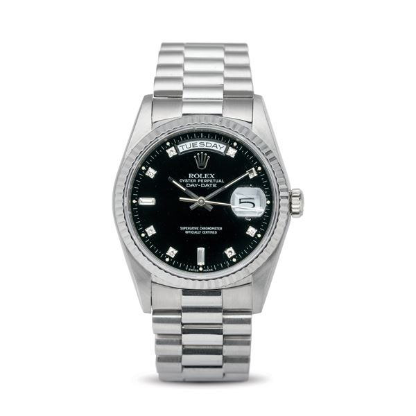 Rolex - Daydate ref 18239 in 18k white gold, polished black dial with diamond hour markers, President bracelet with folding clasp, accompanied by original warranty