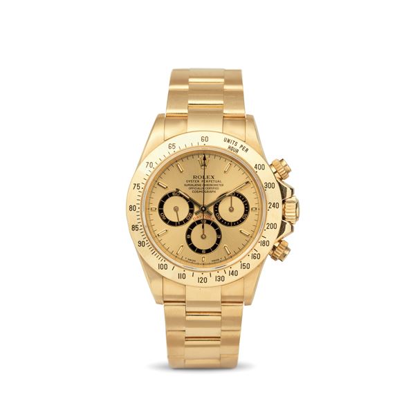 Rolex - Iconic and sought-after Cosmograph Daytona ref 16528 in 18k yellow gold, champagne dial with black counters, tachymeter bezel and screw-down buttons, Oyster bracelet