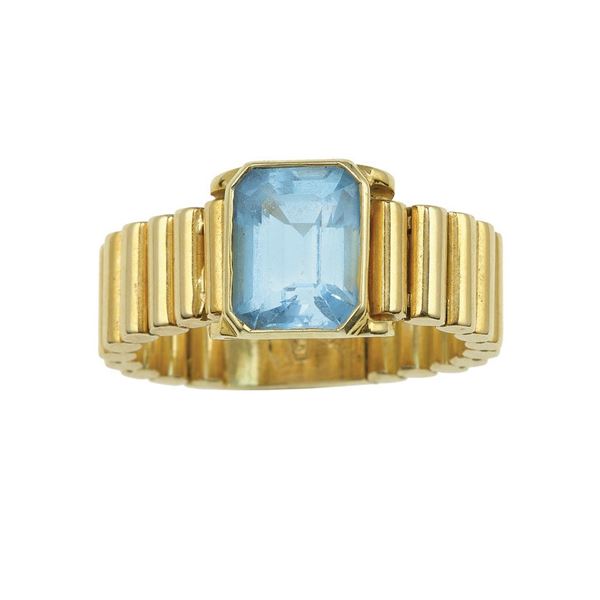Blue topaz and gold ring