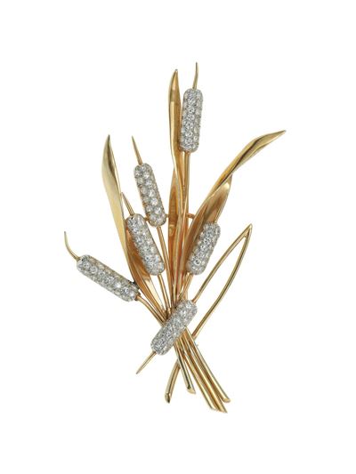 Spilla “tife” con diamanti in oro giallo 14K