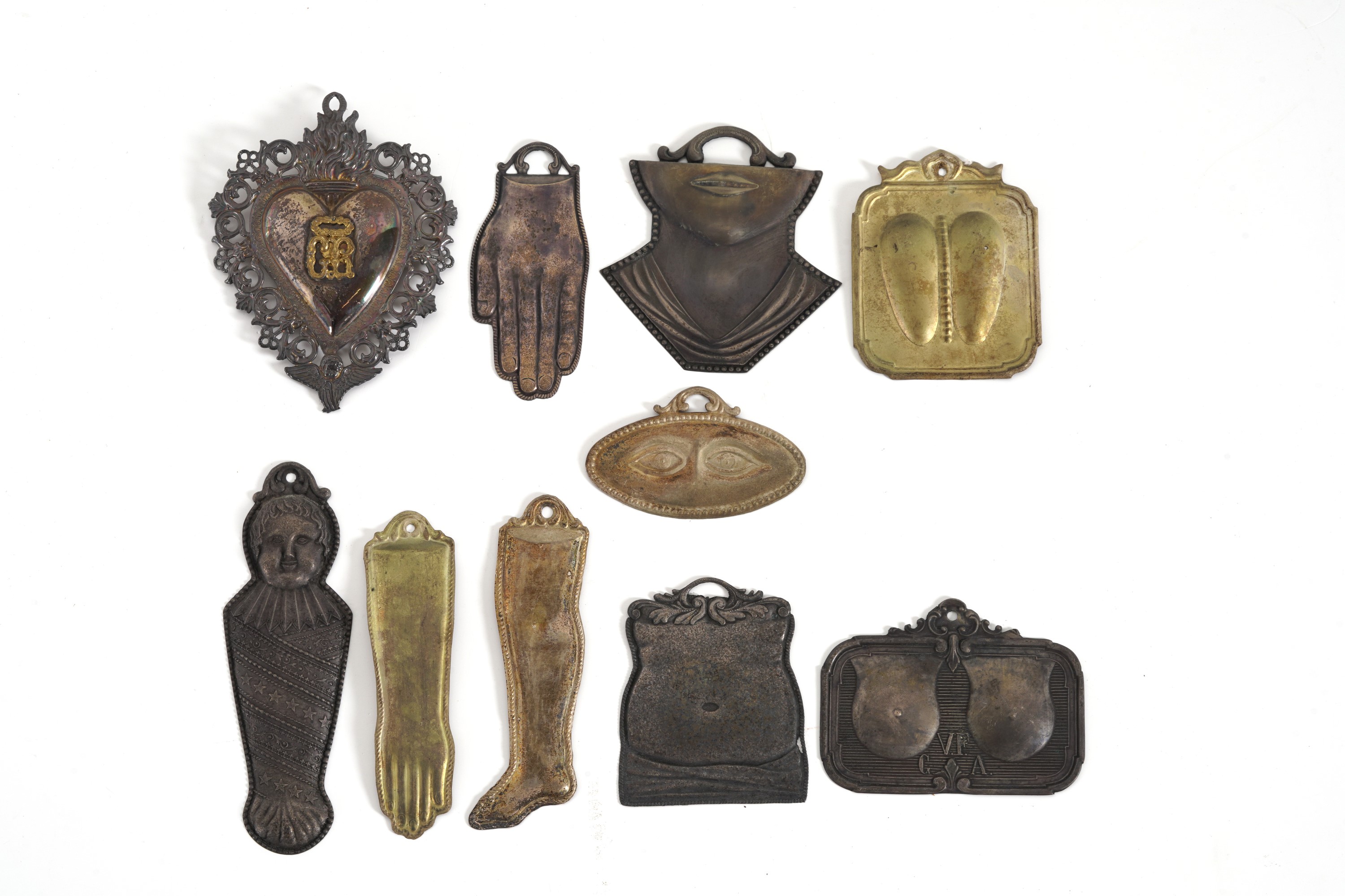 Gruppo di Diciannove Ex Voto in Metallo. XIX-XX Secolo