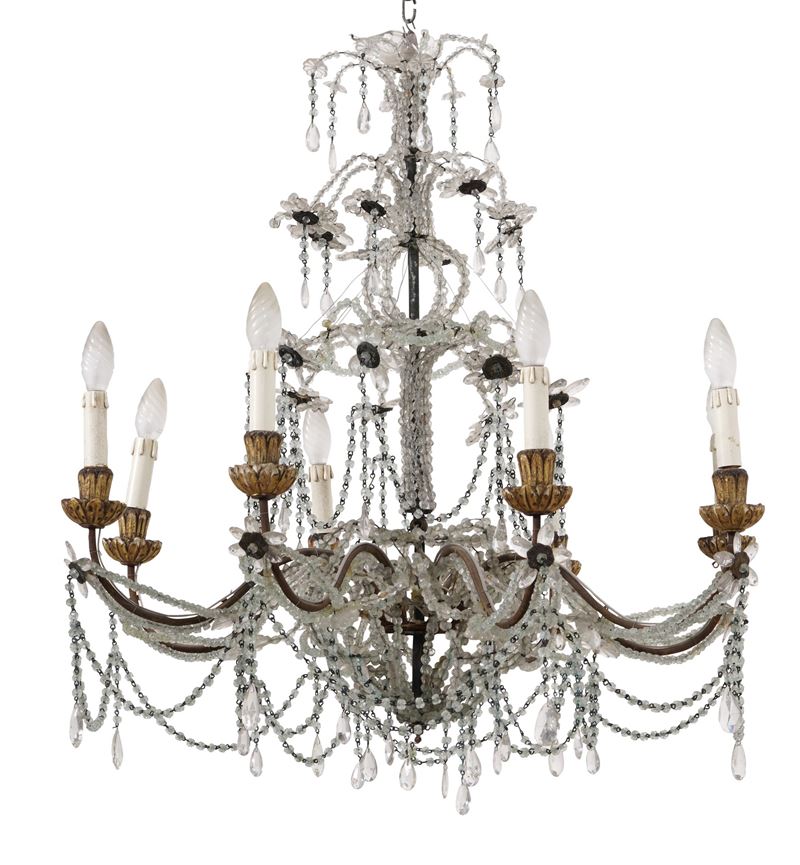 Lampadario a otto luci in metallo e cristalli. XIX secolo  - Asta Fabio Fazio, arredi e ricordi di una casa di campagna - Cambi Casa d'Aste