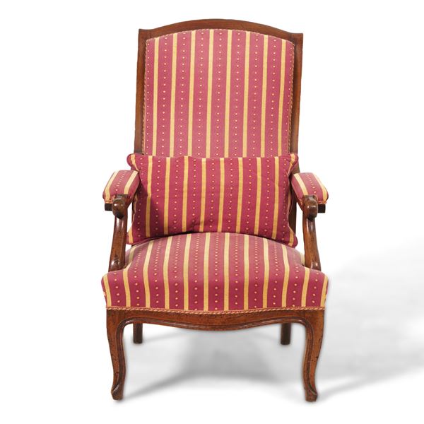 Poltrona in legno intagliato. XIX secolo