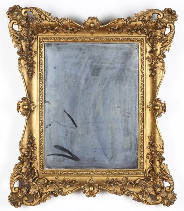 Specchio con cornice dorata. XX secolo
