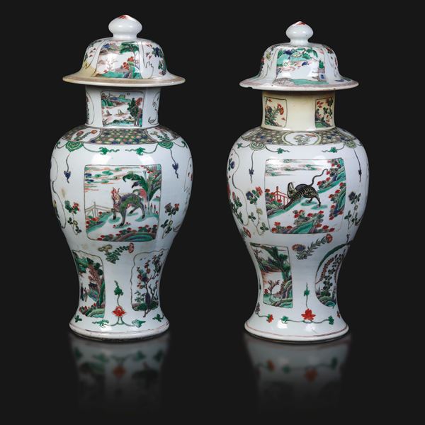 Pair of famille verte porcelain vases with mythological animal scenes within reserves and floral decoration, China, Qing Dynasty, Kangxi period (1662–1722).