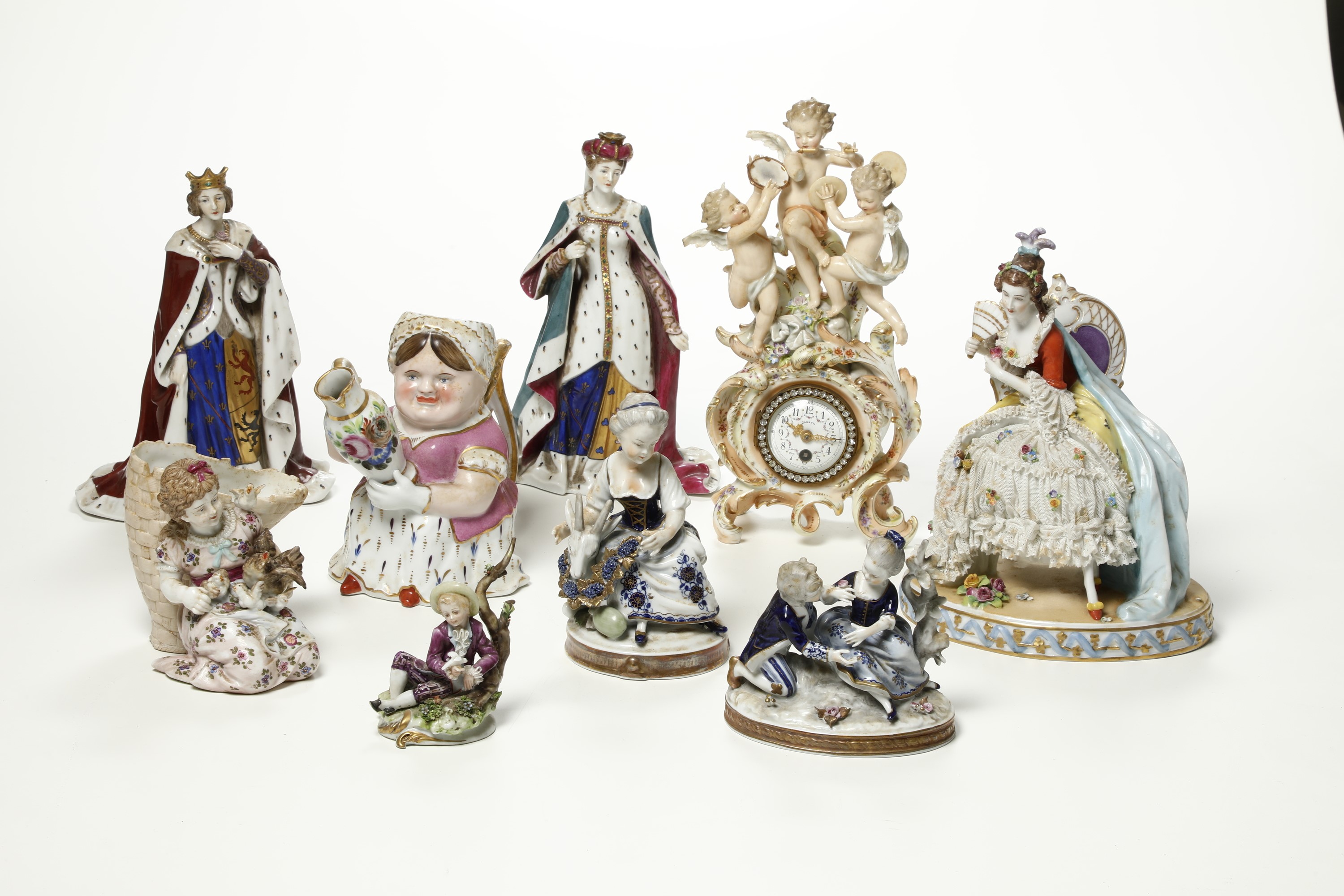 Diverse Figurine e un Orologio, XX Secolo.