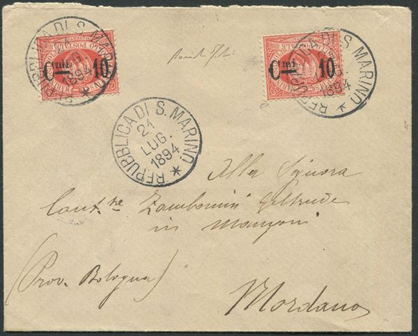 1894, S. Marino, busta per Mordano (BO), affrancata con due es. del 20c. rossi con soprastampa “C.mi 10” capovolta (10a)