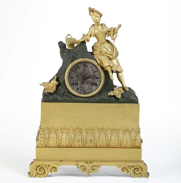Pendola da tavolo in bronzo dorato e brunito. XIX-XX secolo