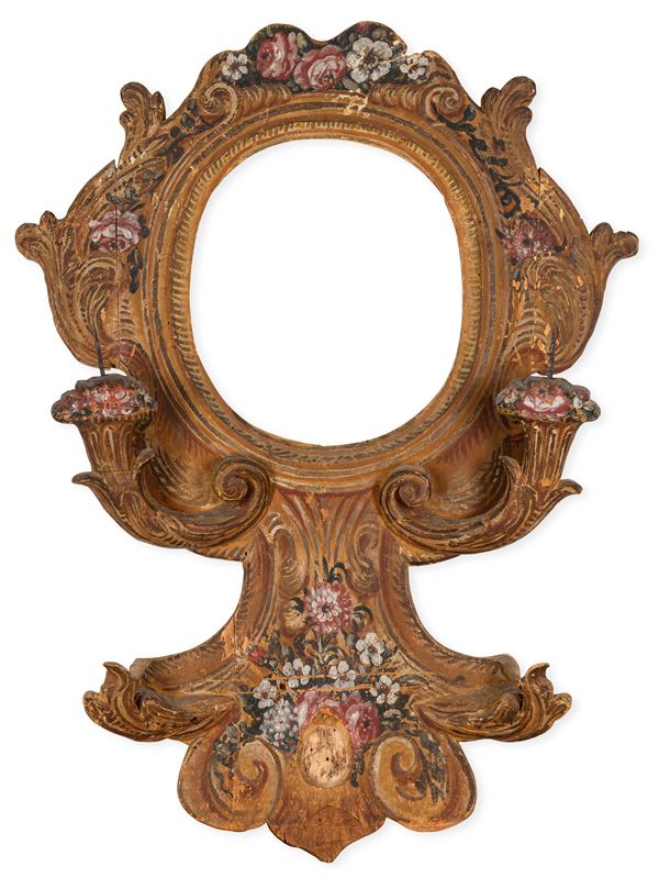 Cornice in legno intagliato e dipinto a tempera. XVIII secolo