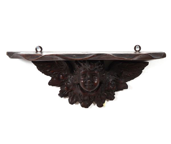 Mensola in legno intagliato. XIX secolo