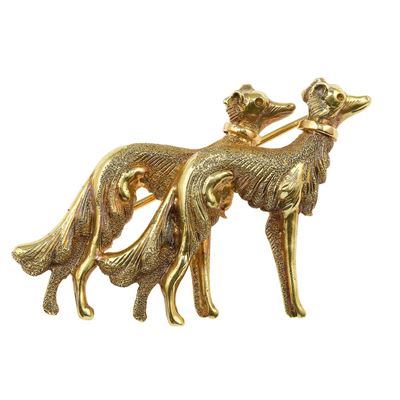 Spilla “levrieri”, montatura in oro giallo 750/1000