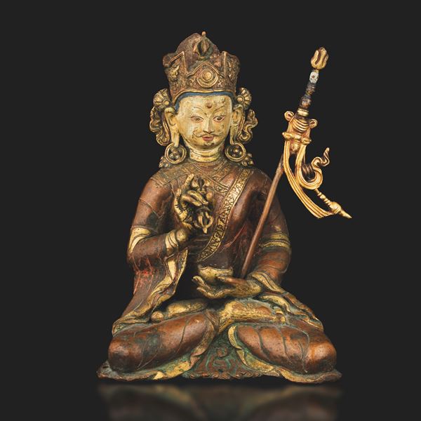 Important and rare partially gilded copper Padmasambhava figure, Tibet, 15th - 16th century