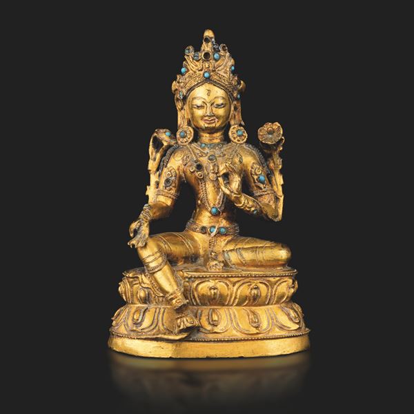 Figura di Tara seduto su doppio fior di loto in bronzo dorato, tracce di policromia e innesti in turchese, Tibet, XVII -  XVIII secolo