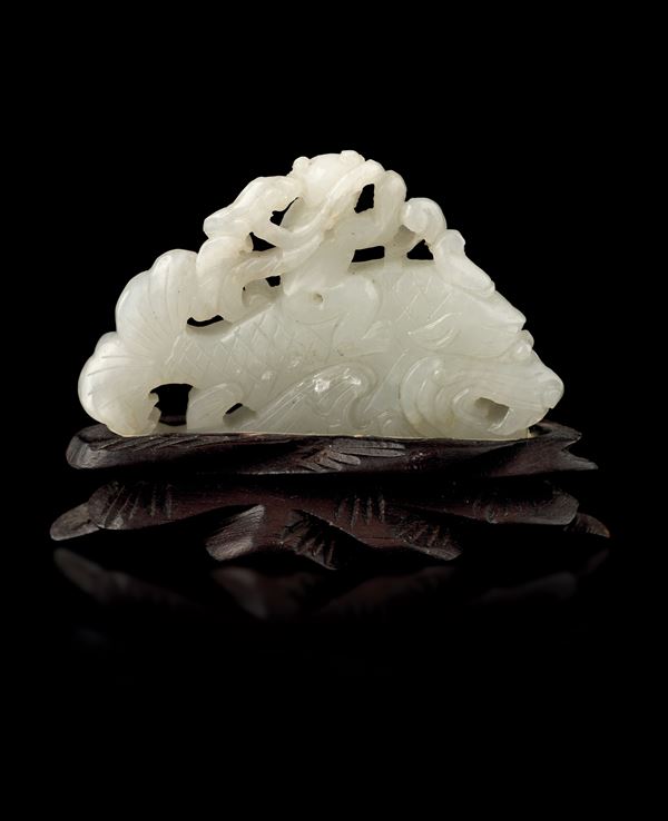 White fretwork jade element depicting fish figure with monk, China, Qing Dynasty, Qianlong period, 18th century