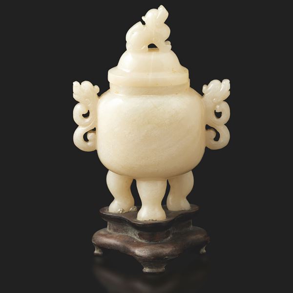 Carved jade tripod container with shaped handles and Pho dog-shaped lid socket, China, Qing Dynasty, 19th century