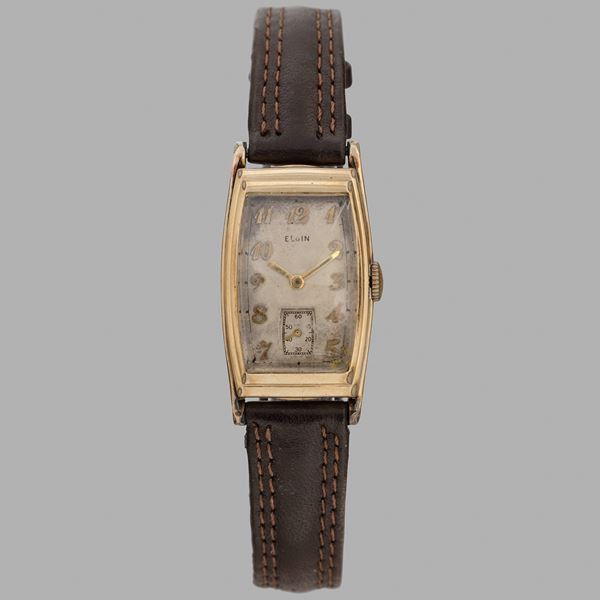 Tegolino Tonneau in oro giallo 10k, quadrante argentè con numeri Breguet applicati e piccoli secondi al sei, carica manuale, 33x22 mm