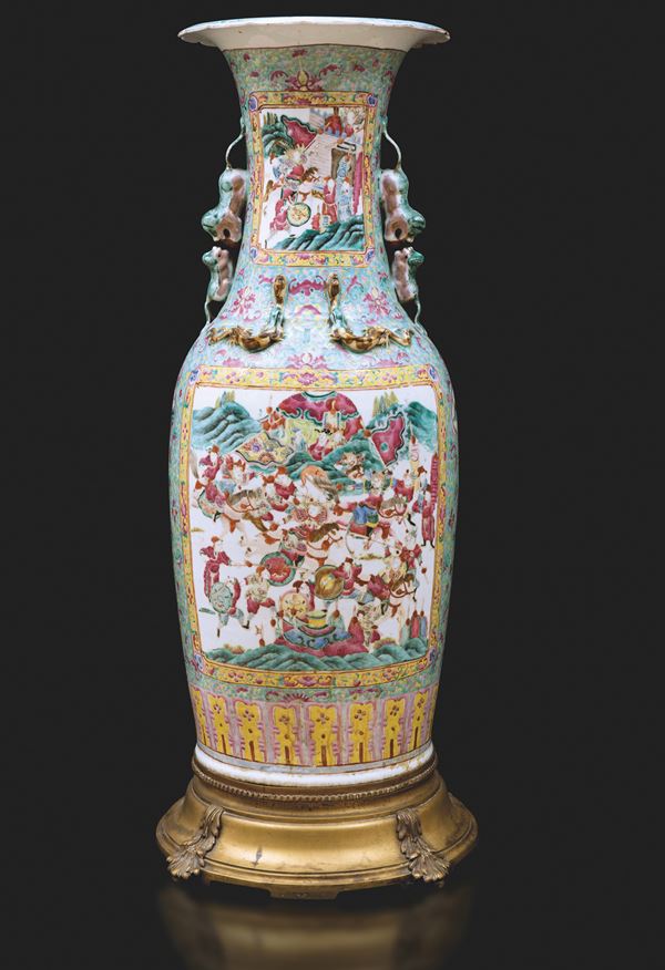 Large polychrome porcelain vase in Famille Rose tones depicting court life scene within reserves, floral decorations and lion-shaped handles resting on gilt bronze base, China, Qing Dynasty, 19th century