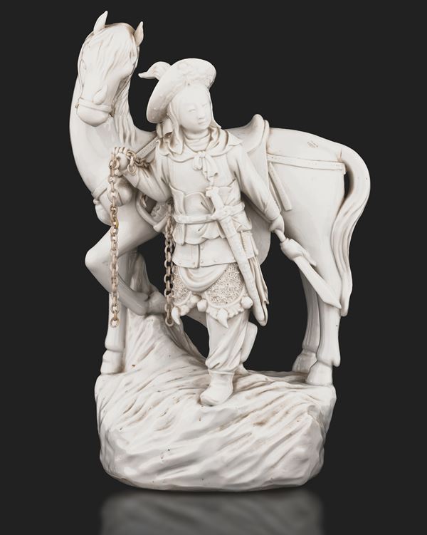 Blanc de Chine porcelain group depicting man and horse with chain, China, Qing Dynasty, Daoguang era, late 19th century