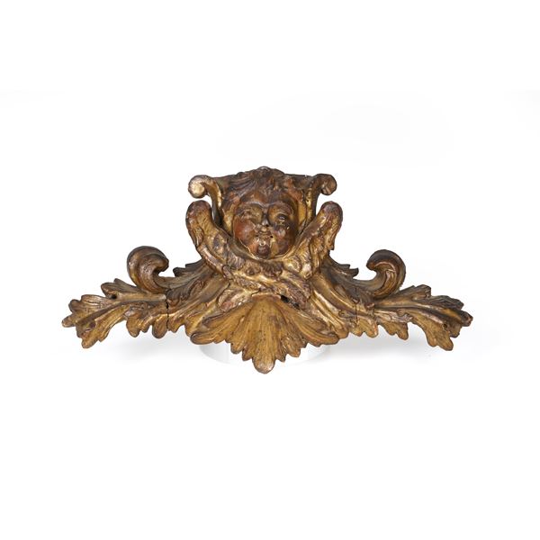 Fregio in legno intagliato con cherubino e dorato. XVIII secolo