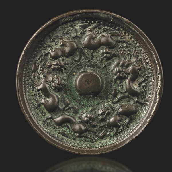 Bronze mirror with fantastic animals in relief, China, Han Dynasty, 12th century