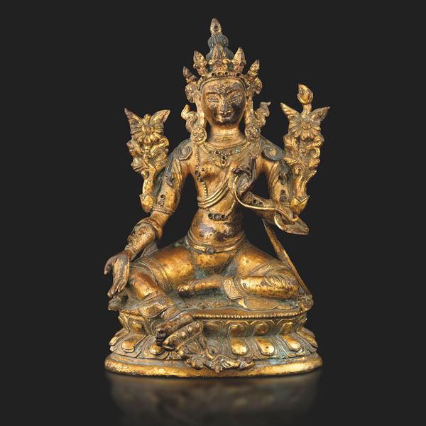 Gilt bronze Buddha figure seated on double lotus flower with gemstone inserts, Nepal, 17th century