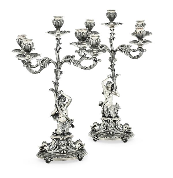 Coppia di candelabri a cinque fiamme. Argenteria artistica milanese del XX secolo. Argentieri Fratelli Cacchione