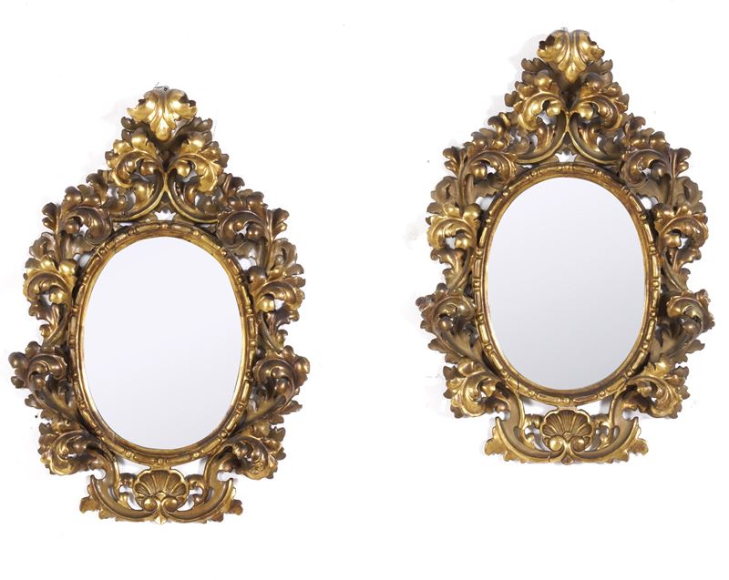 Coppia di specchiere in legno intagliato e dorato. XX secolo  - Asta Antiquariato - Cambi Casa d'Aste