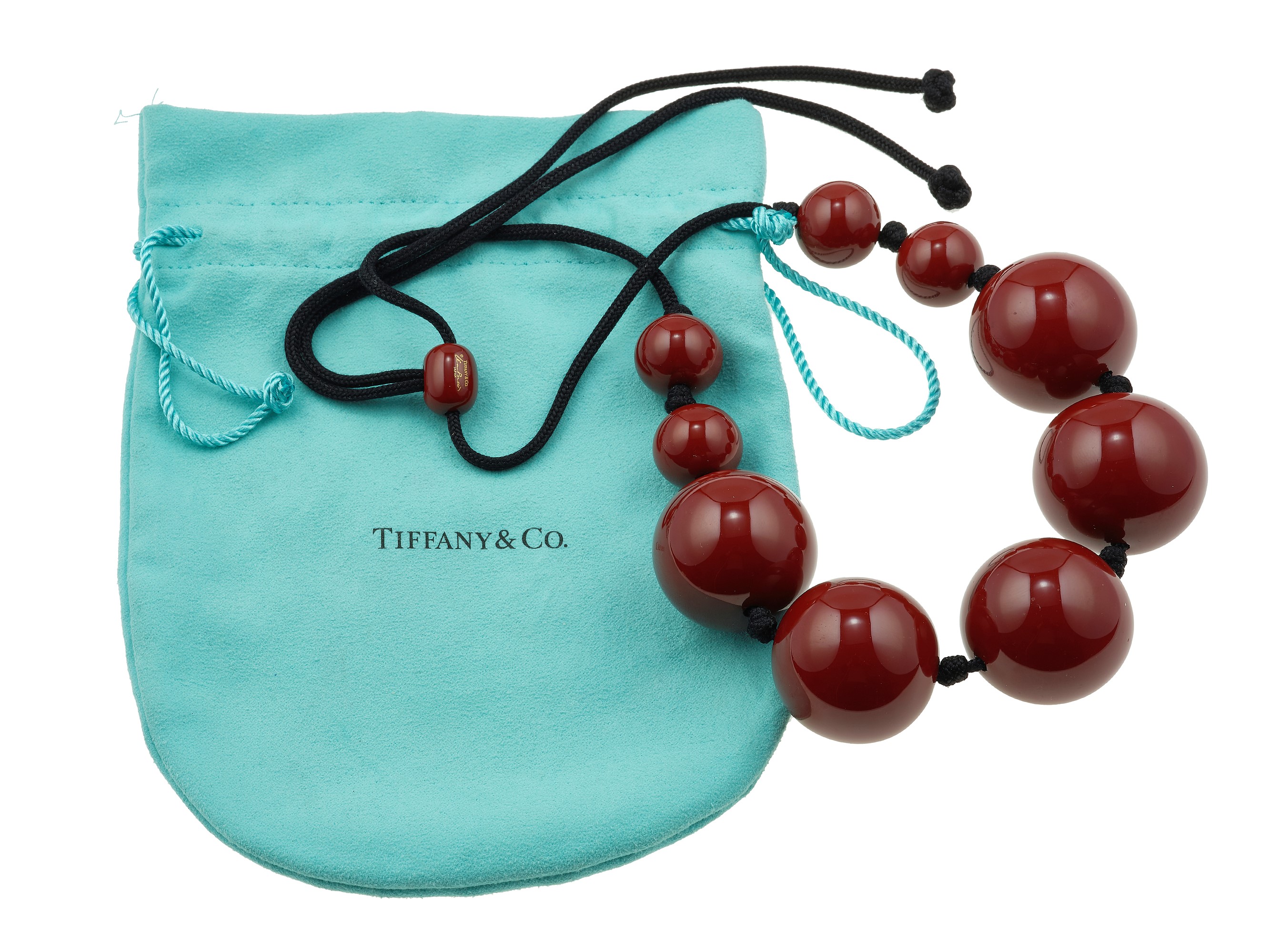 Elsa Peretti for Tiffany & Co., girocollo “Sphere” in lacca marrone su supporto in legno