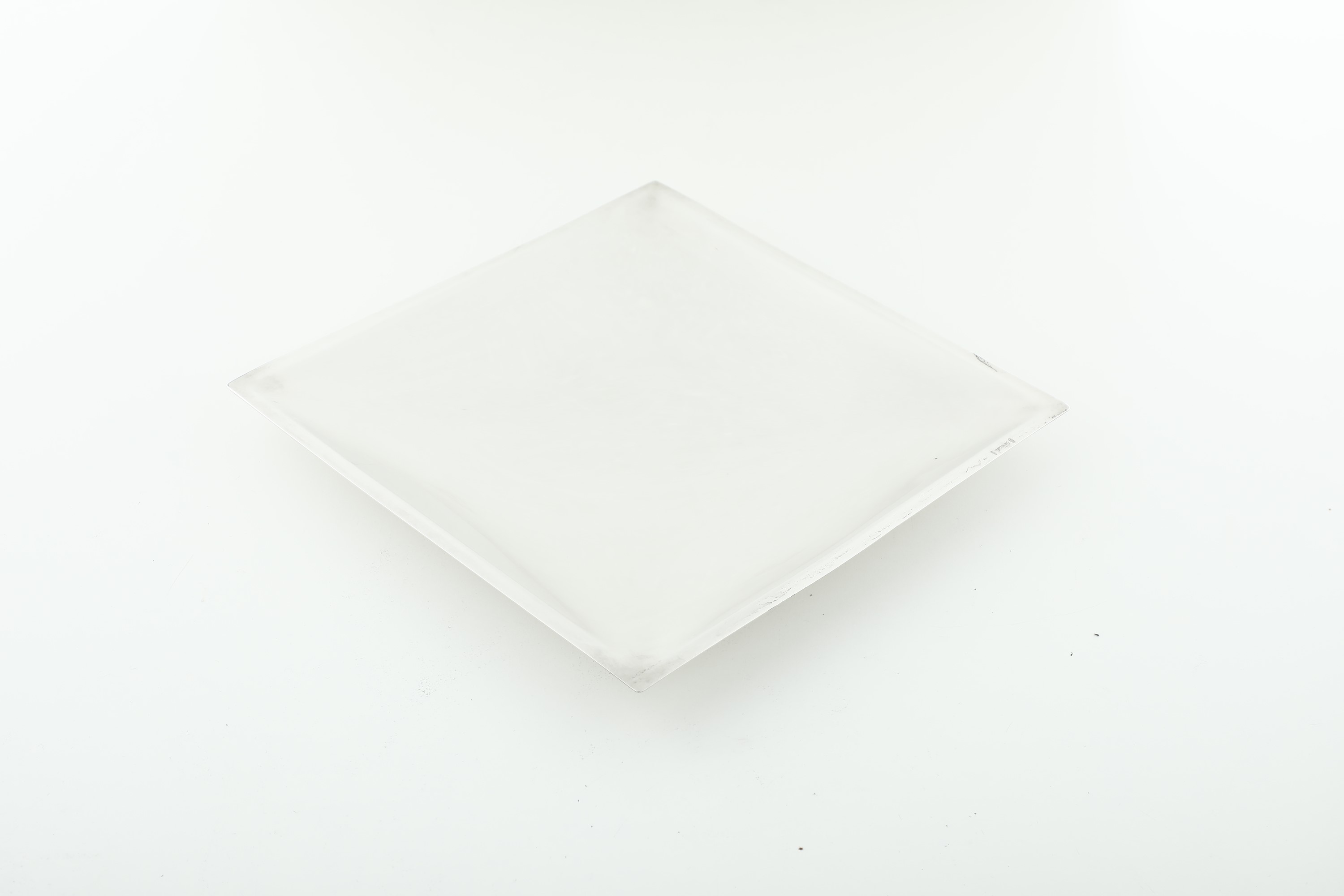 Design De Vecchi, Svuotatasche in argento fuso e sagomato