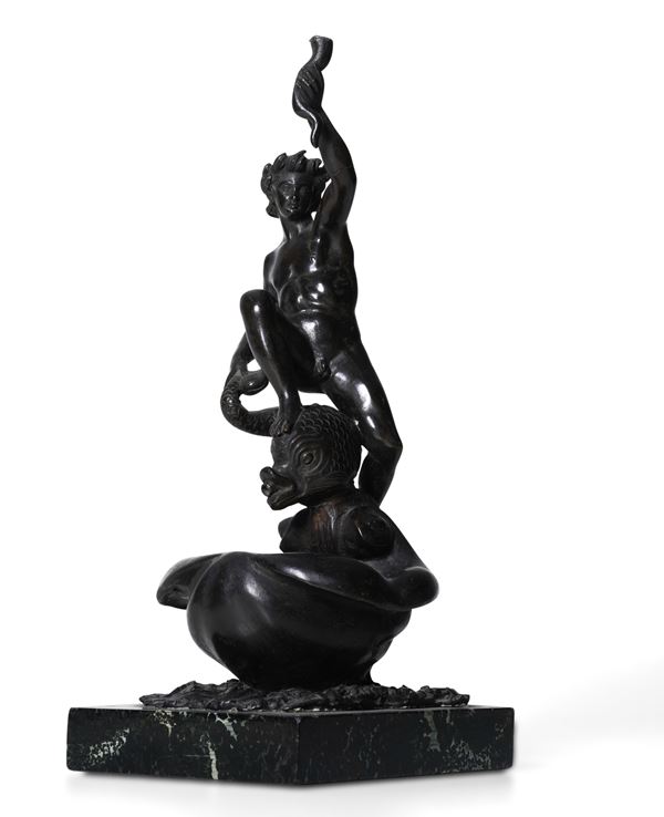 Figura maschile su delfino. Fonditore del XX secolo