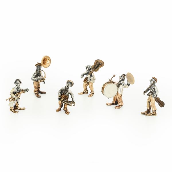 Sei sculturine di musici in argento, vermeille e bronzo. Firmati Angini. Punzone argentiere: stella 105 AR, Pietro Sorini & Casi Ilario S.d.f.