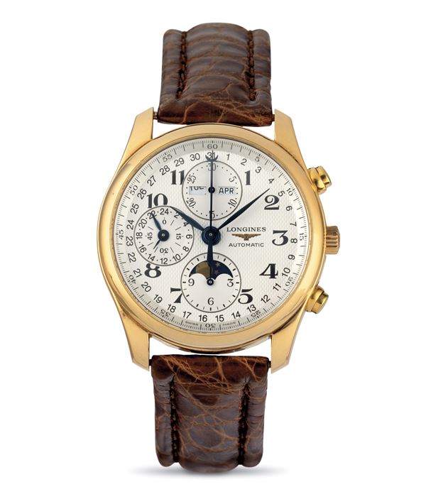Longines - Master Collection in 18k yellow gold full calendar chronograph and moon phase indications, exposed case back accompanied by Original box and guarantee