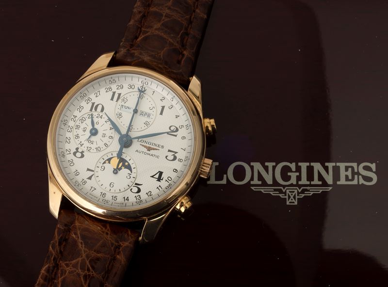 Longines Master Collection in 18k yellow gold full calendar chronograph and moon phase indications exposed case back accompanied by Original box and guarantee Auction Watches Cambi Casa d Aste