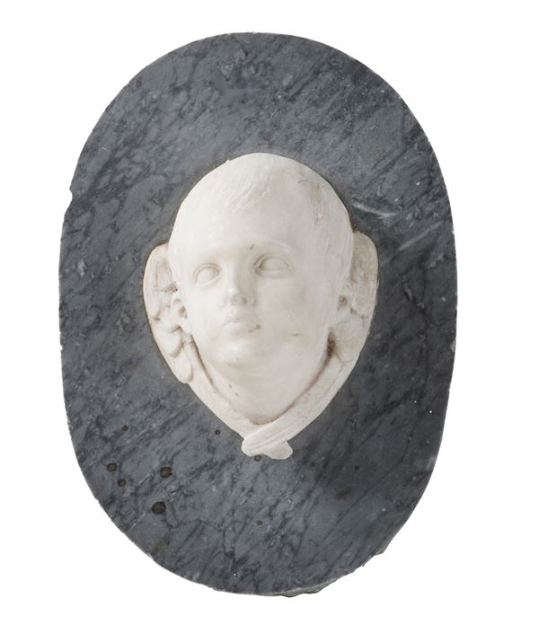 Rilievo in marmo con testa di angioletto