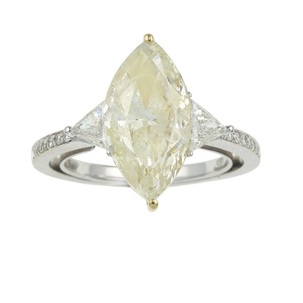 Natural fancy light yellow diamond weighing 5.08 carats and gold ring