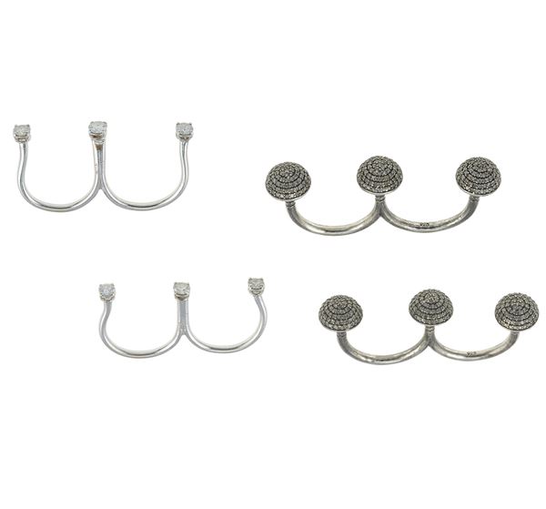 Four diamond, gold and silver rings