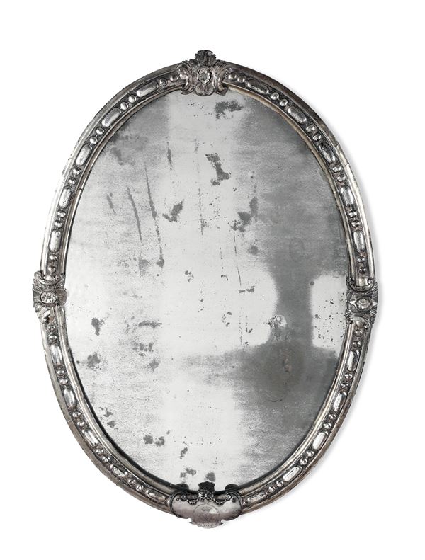 Importante cornice ovale in argento con specchio. Italia centrale, inizi del XVIII secolo