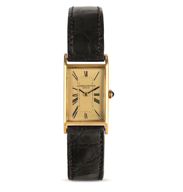 Rectangular 18k yellow gold tank, champagne dial with Roman numerals, manual winding
