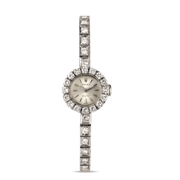 Rolex - Orchid ref 9060 in 18k white gold embellished with 30 diamonds set on the bracelet and 16 on the crown, manual winding accompanied by original box