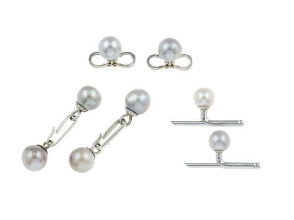 Group of pearl cufflinks and studs. One pair of studs signed Cartier, Paris